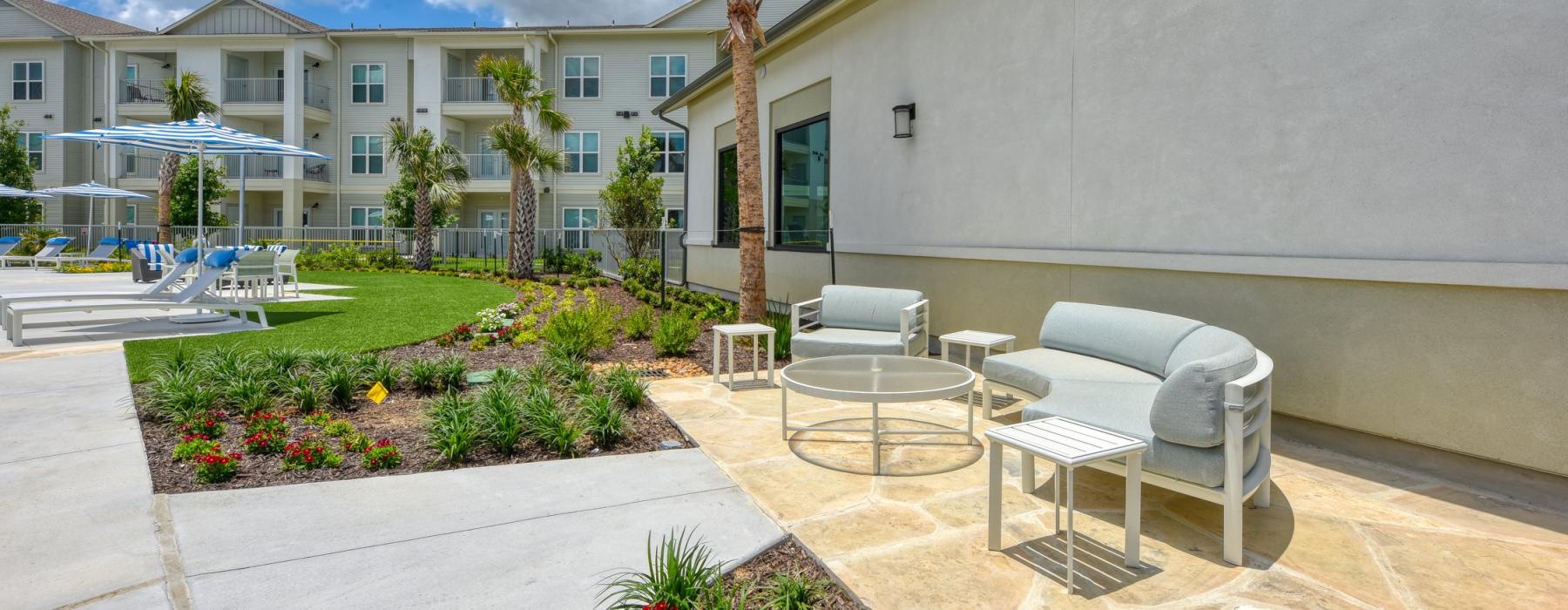a courtyard with chairs and tables