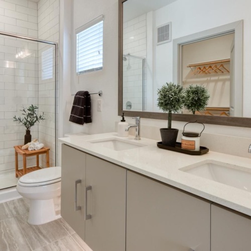 a bathroom with a glass, walk-in shower