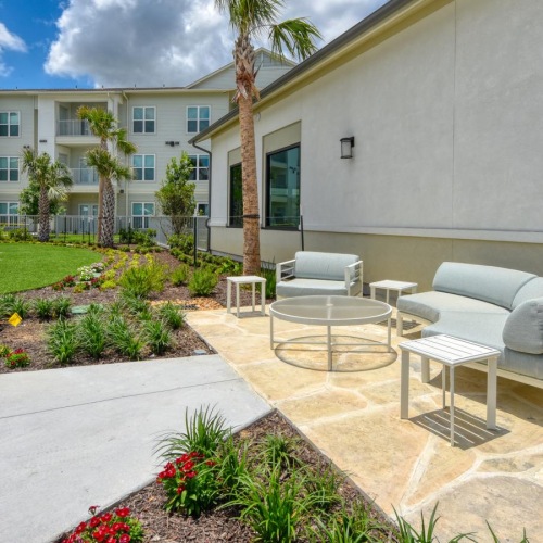a courtyard with chairs and tables